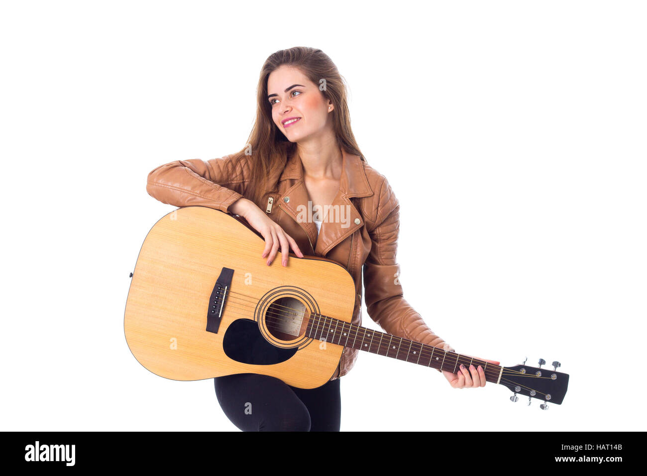 Junge Frau mit einer Gitarre Stockfoto