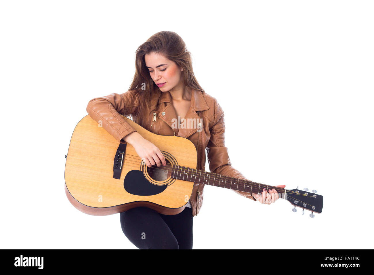 Junge Frau mit einer Gitarre Stockfoto
