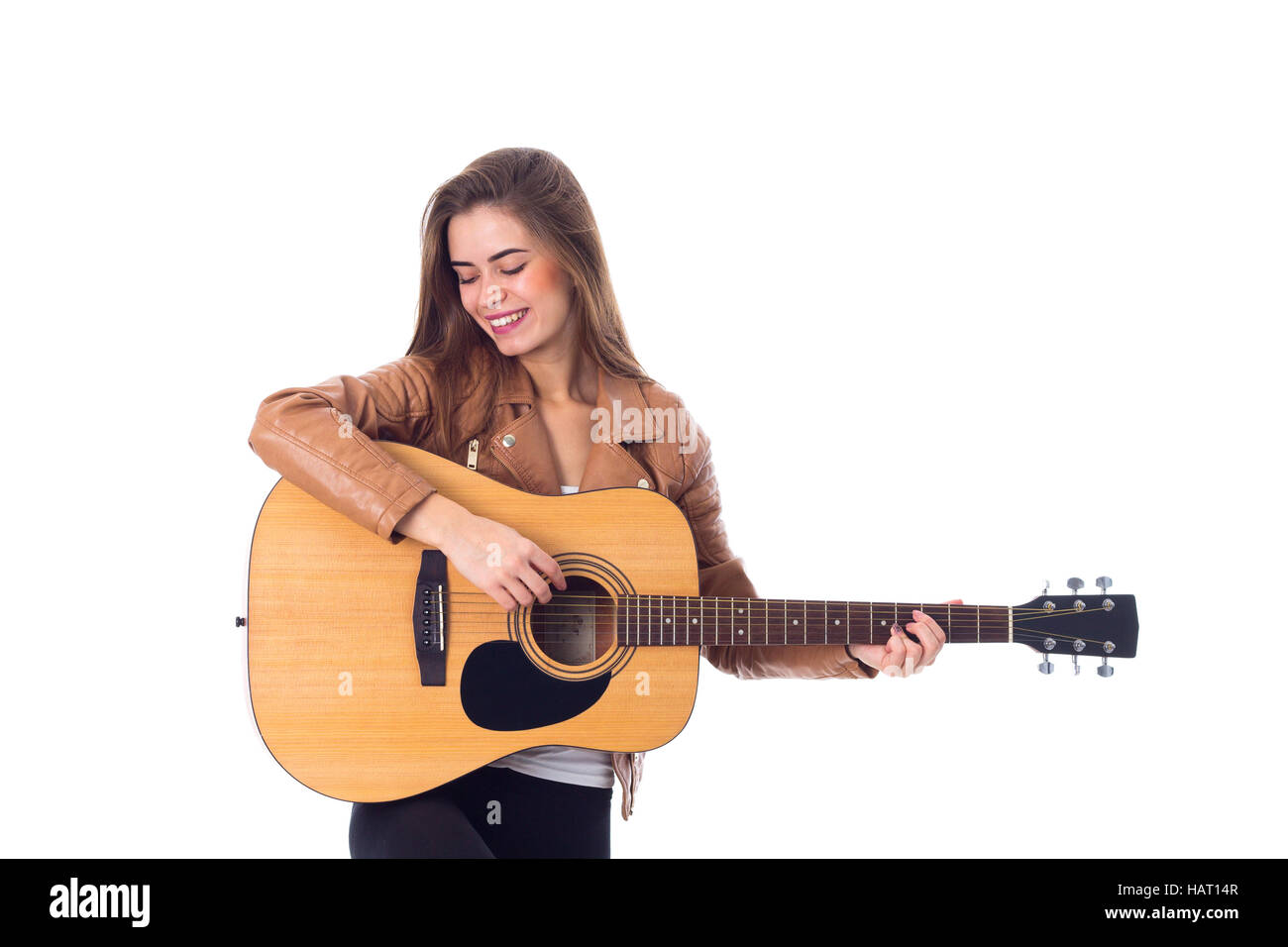 Junge Frau mit einer Gitarre Stockfoto