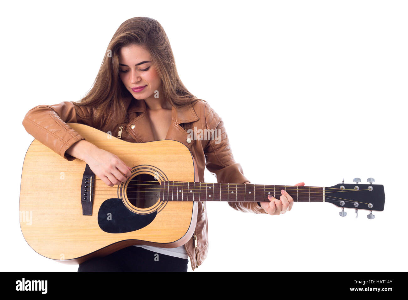 Junge Frau mit einer Gitarre Stockfoto