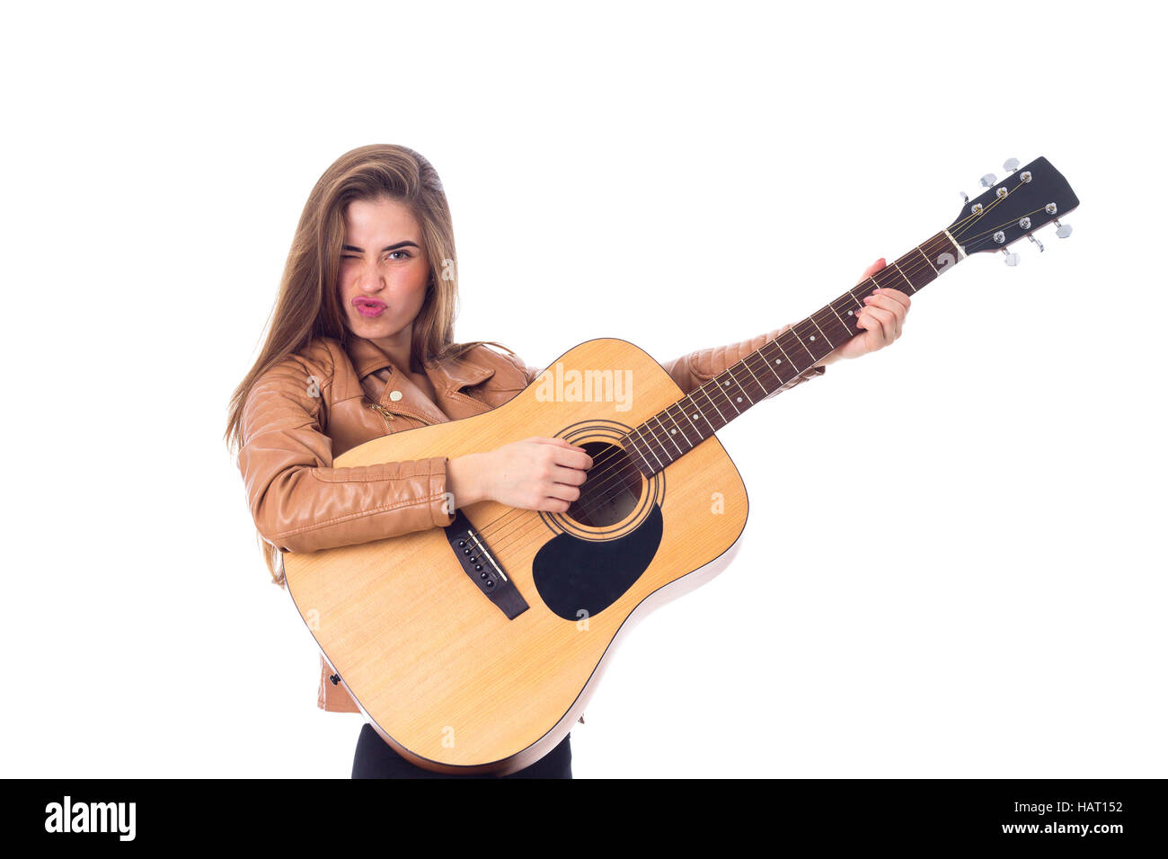 Junge Frau mit einer Gitarre Stockfoto