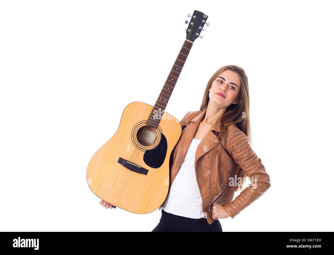 Junge Frau mit einer Gitarre Stockfoto