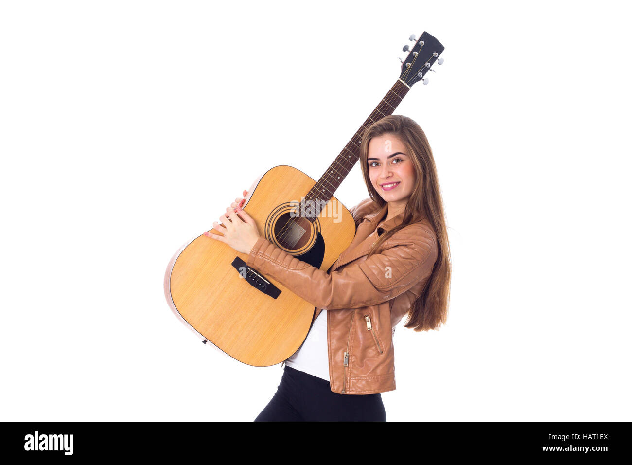 Junge Frau mit einer Gitarre Stockfoto