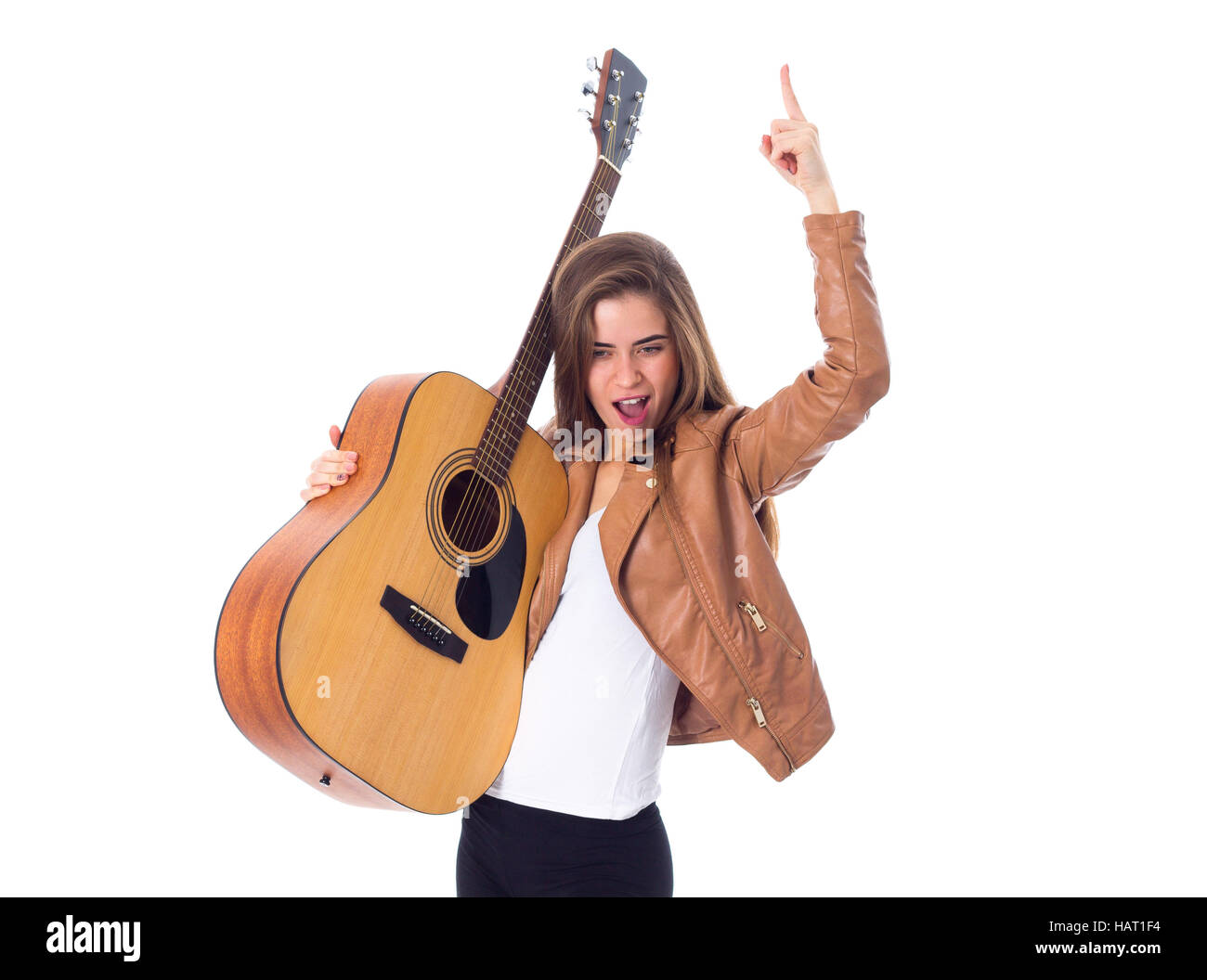 Junge Frau mit einer Gitarre Stockfoto