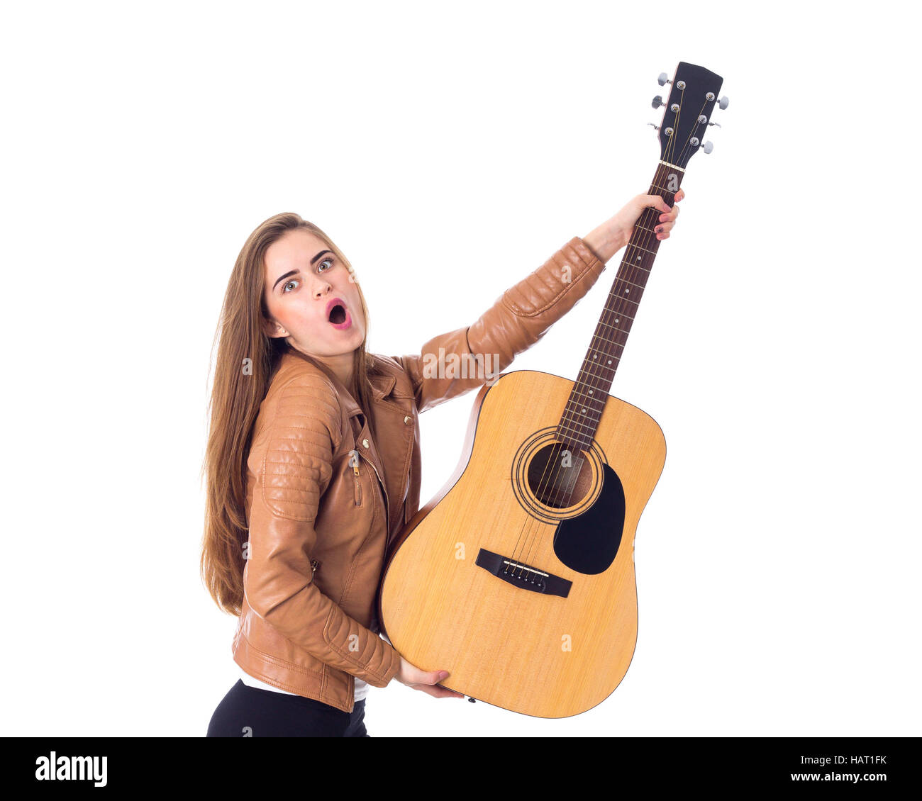 Junge Frau mit einer Gitarre Stockfoto