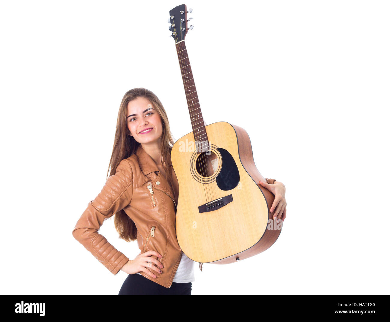 Junge Frau mit einer Gitarre Stockfoto