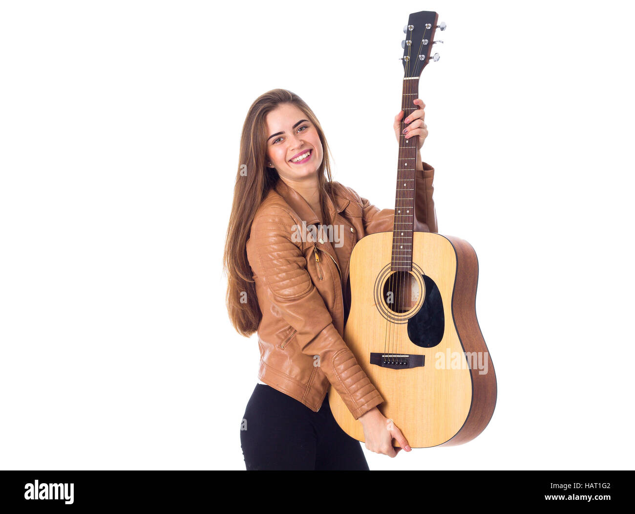 Junge Frau mit einer Gitarre Stockfoto