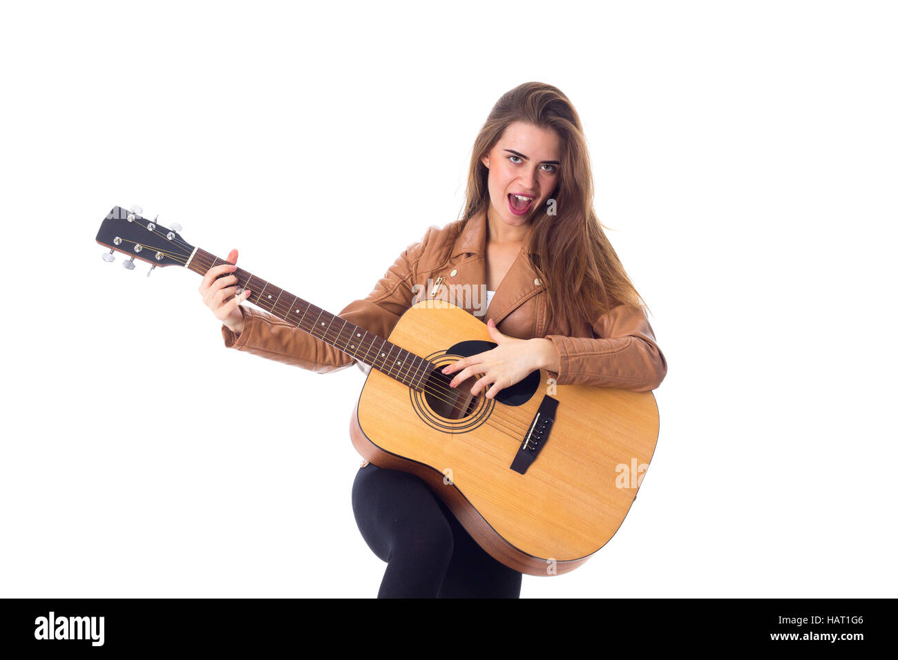 Junge Frau mit einer Gitarre Stockfoto