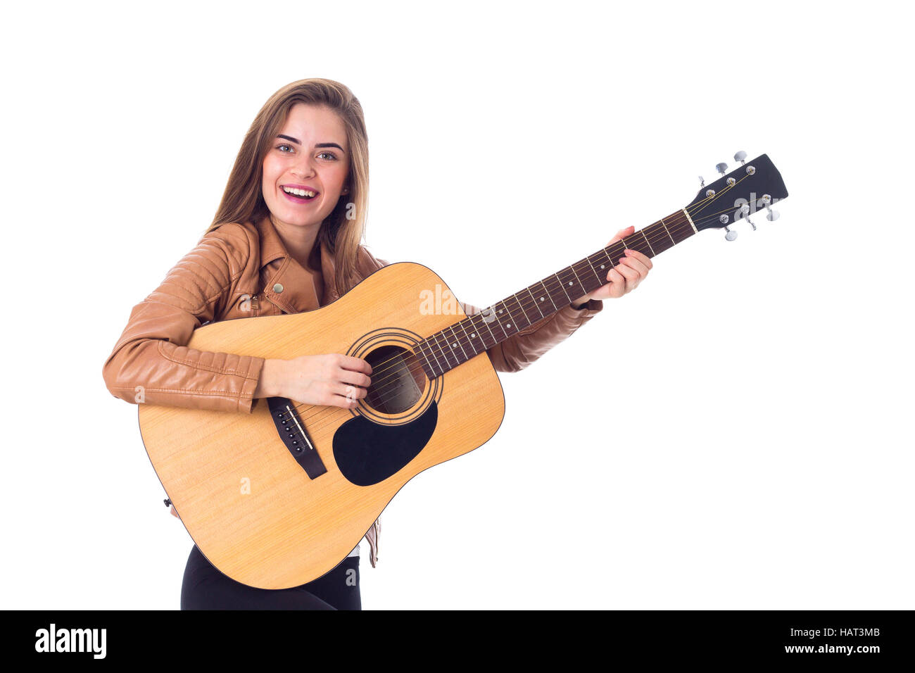 Junge Frau mit einer Gitarre Stockfoto