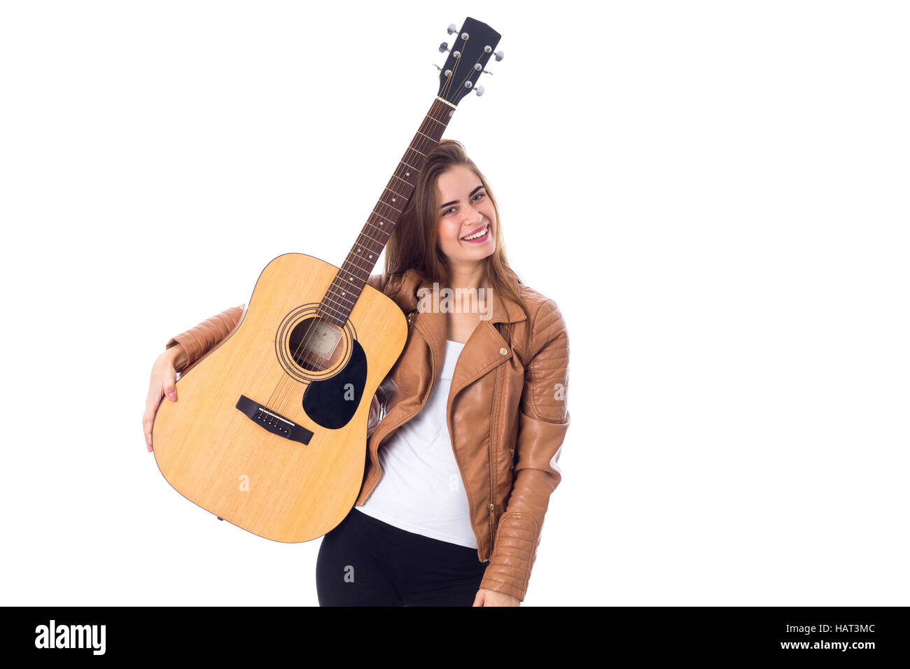 Junge Frau mit einer Gitarre Stockfoto