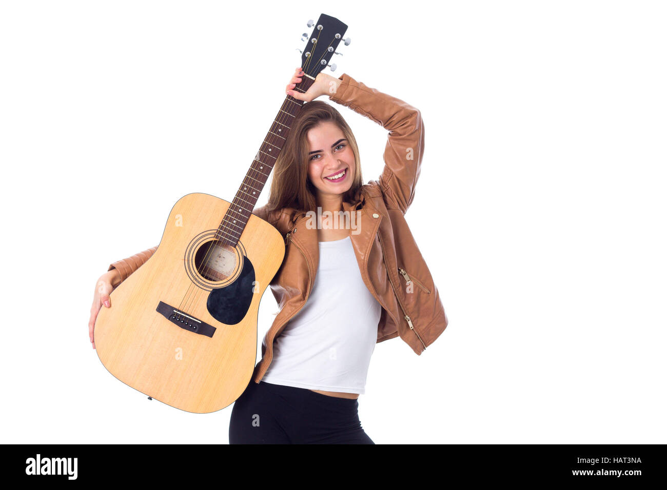 Junge Frau mit einer Gitarre Stockfoto