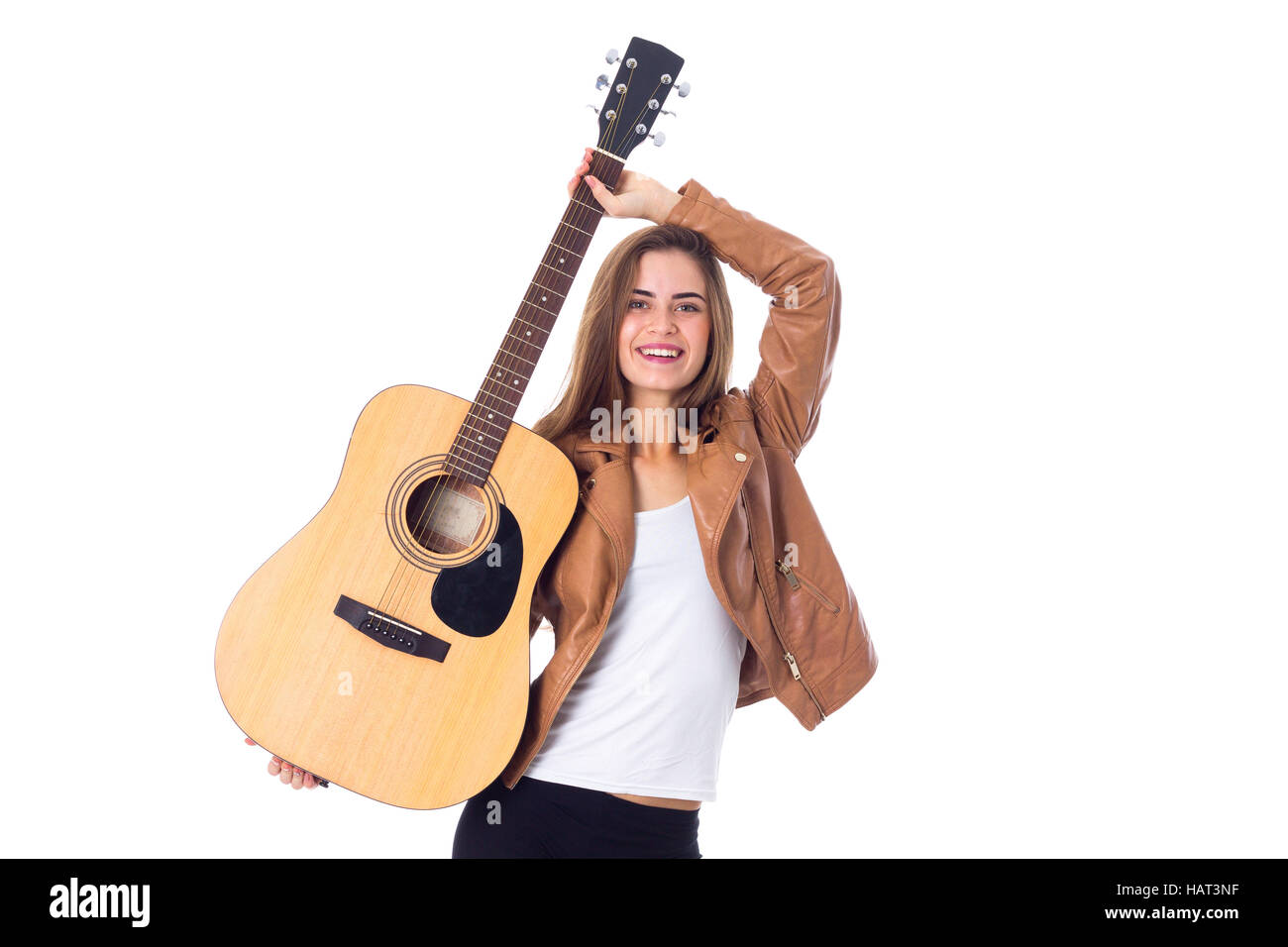 Junge Frau mit einer Gitarre Stockfoto