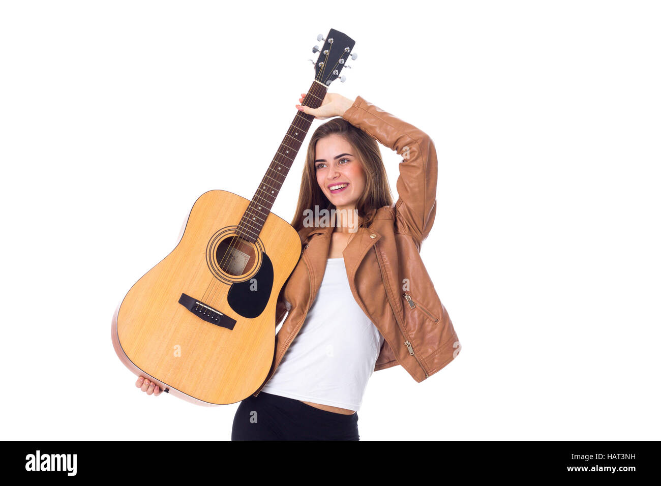 Junge Frau mit einer Gitarre Stockfoto