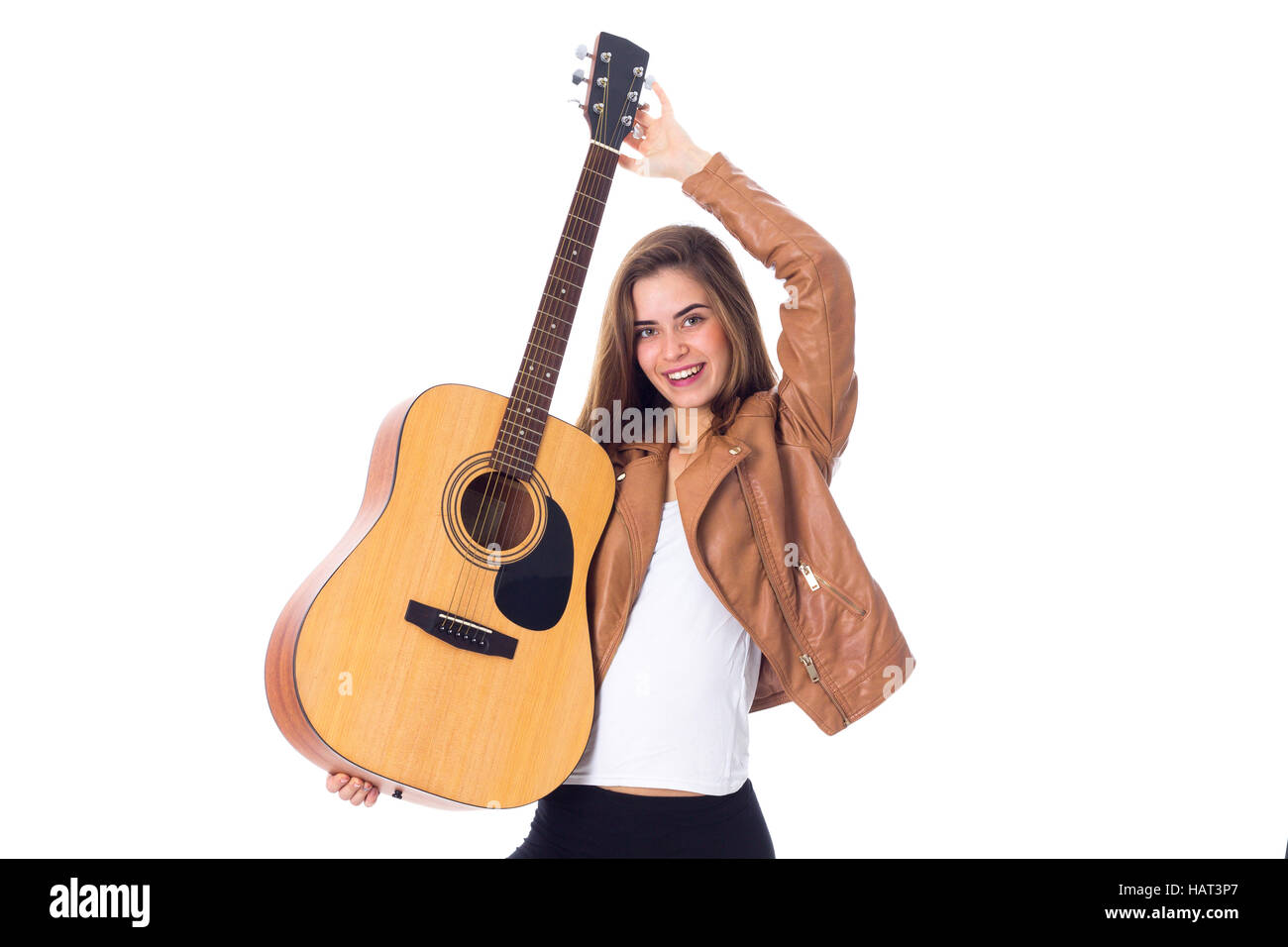 Junge Frau mit einer Gitarre Stockfoto