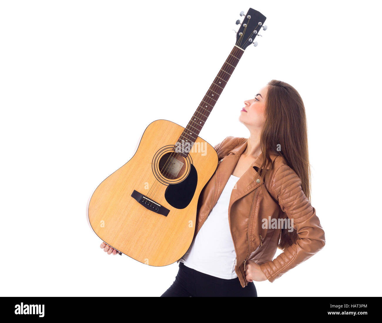 Junge Frau mit einer Gitarre Stockfoto