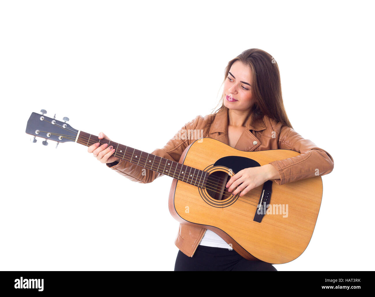 Junge Frau mit einer Gitarre Stockfoto