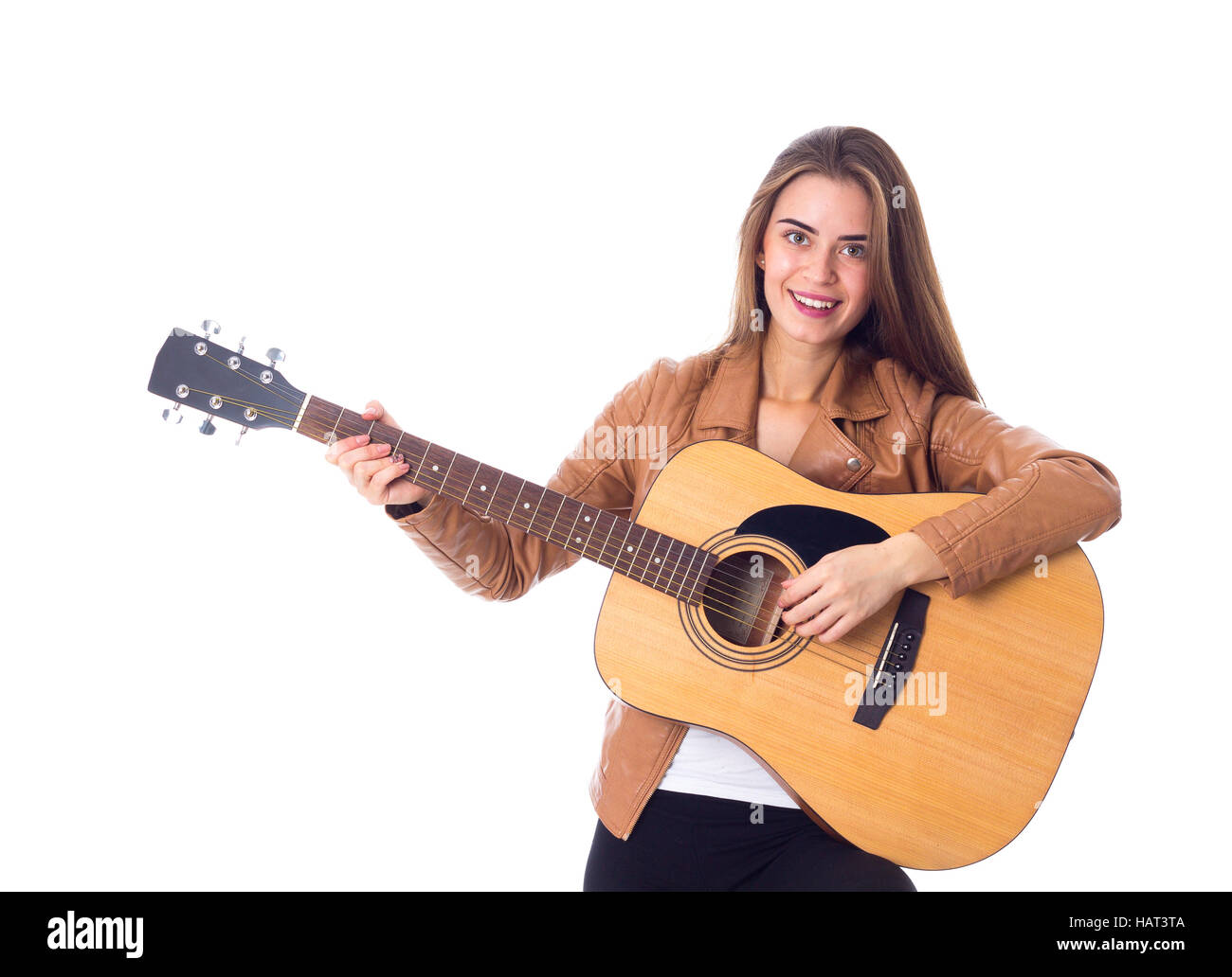 Junge Frau mit einer Gitarre Stockfoto