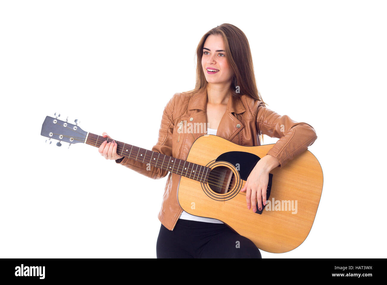 Junge Frau mit einer Gitarre Stockfoto