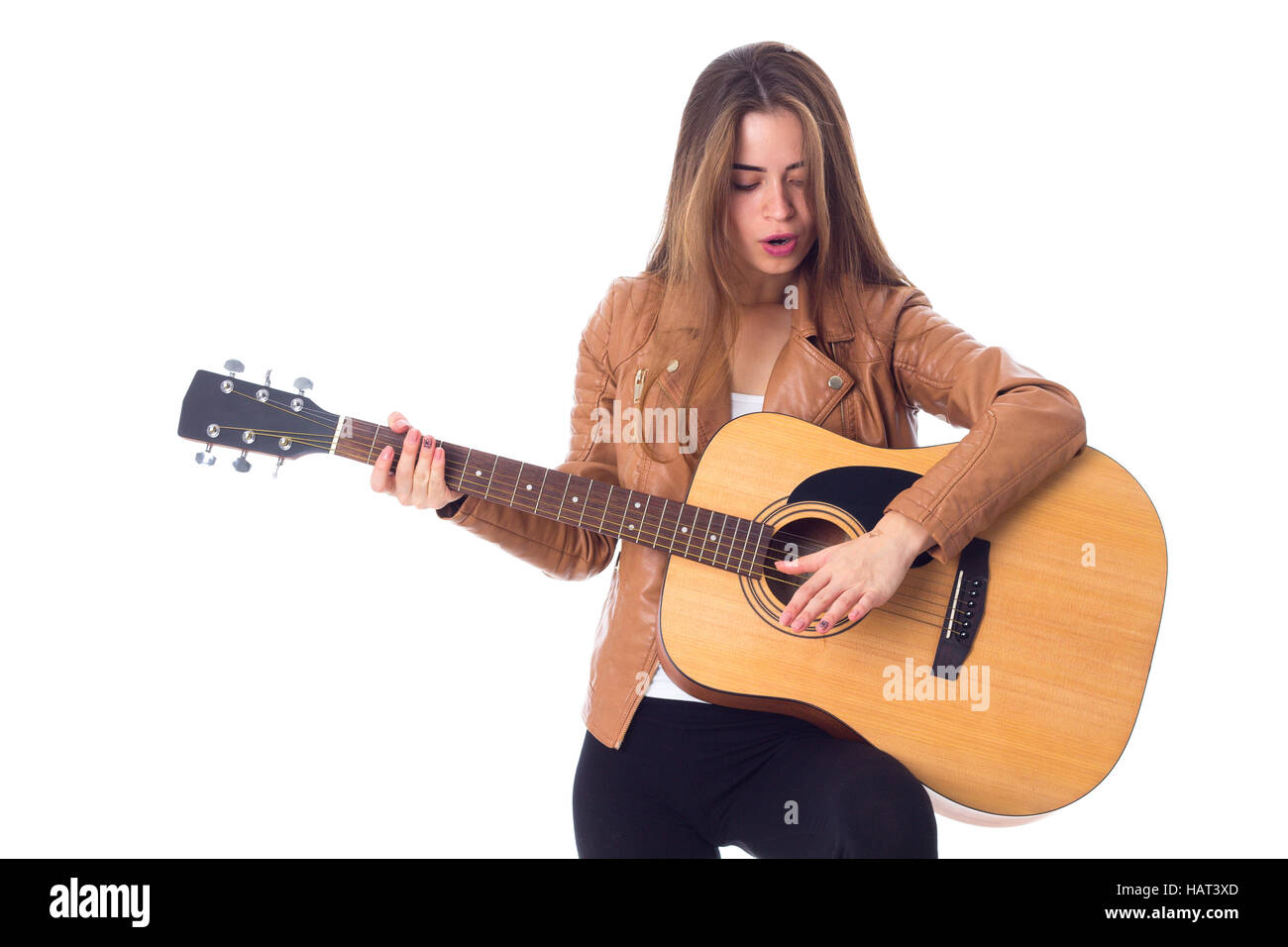 Junge Frau mit einer Gitarre Stockfoto