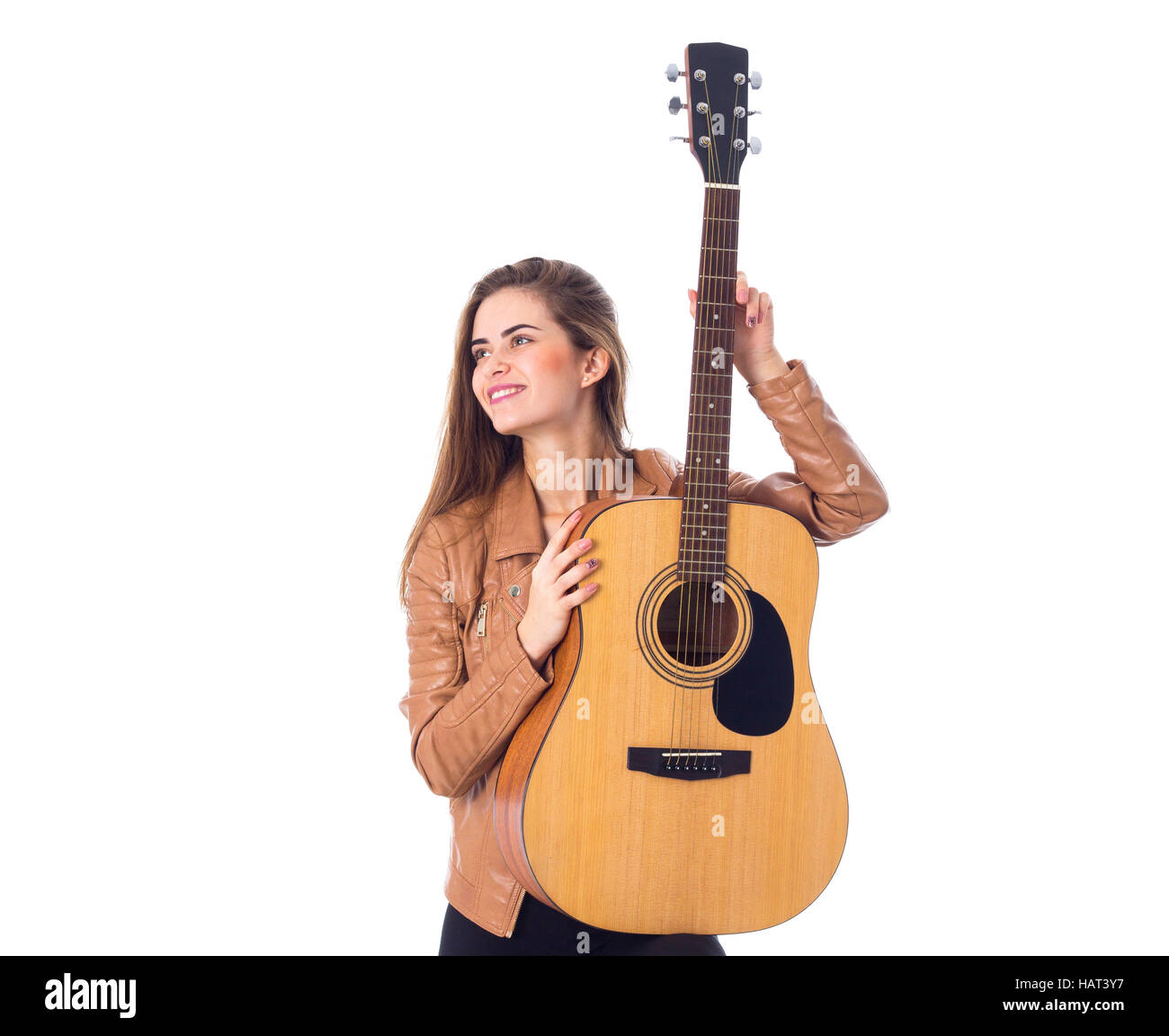 Junge Frau mit einer Gitarre Stockfoto