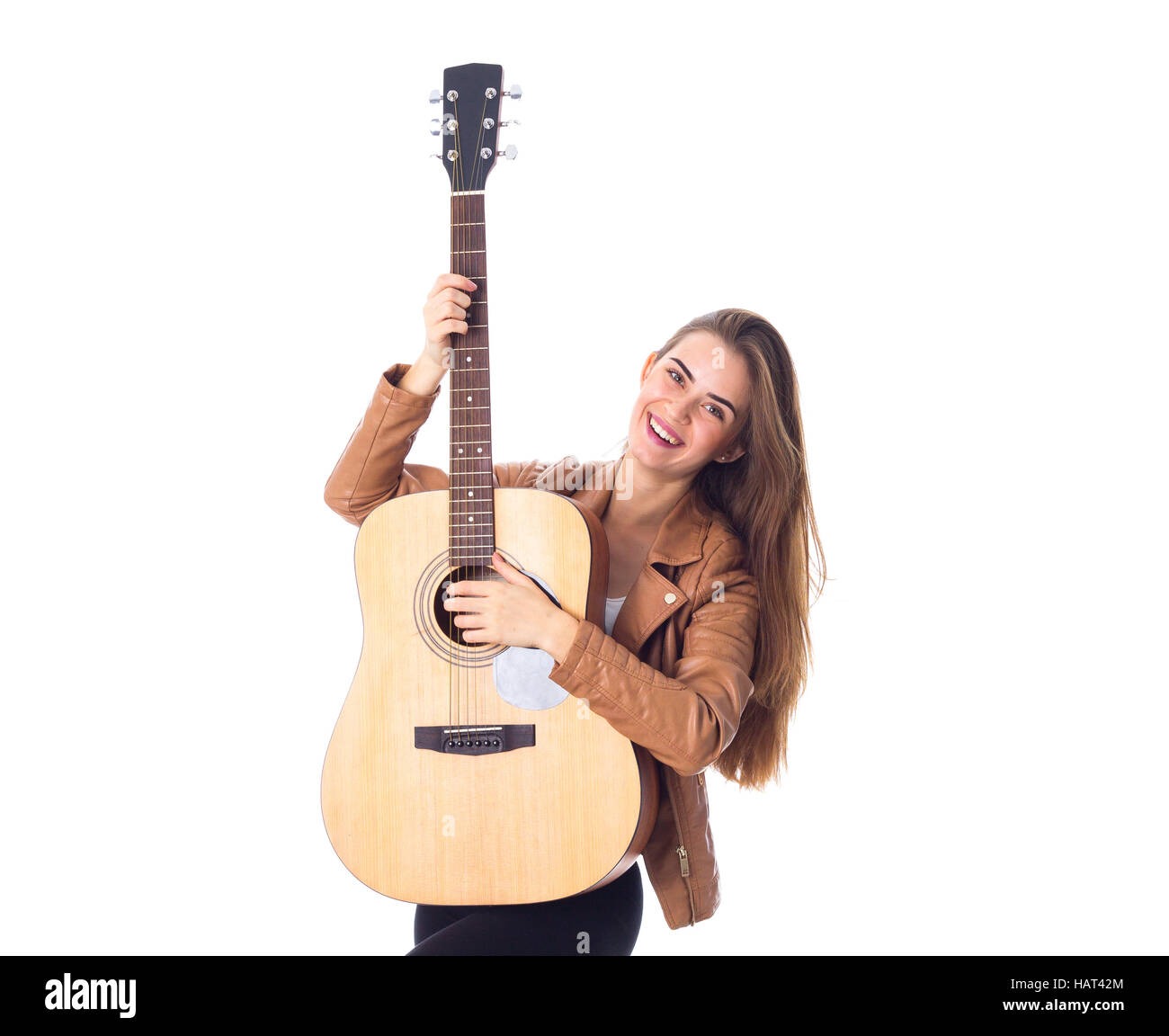 Junge Frau mit einer Gitarre Stockfoto