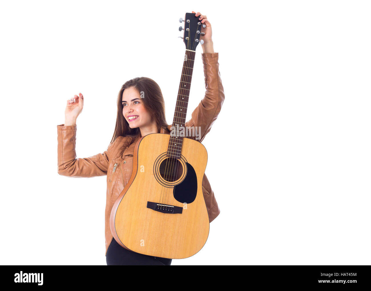 Junge Frau mit einer Gitarre Stockfoto