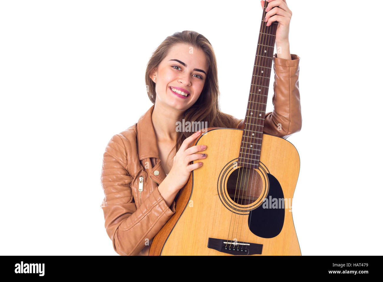 Junge Frau mit einer Gitarre Stockfoto