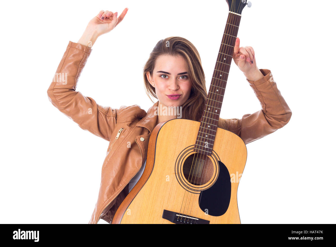 Junge Frau mit einer Gitarre Stockfoto