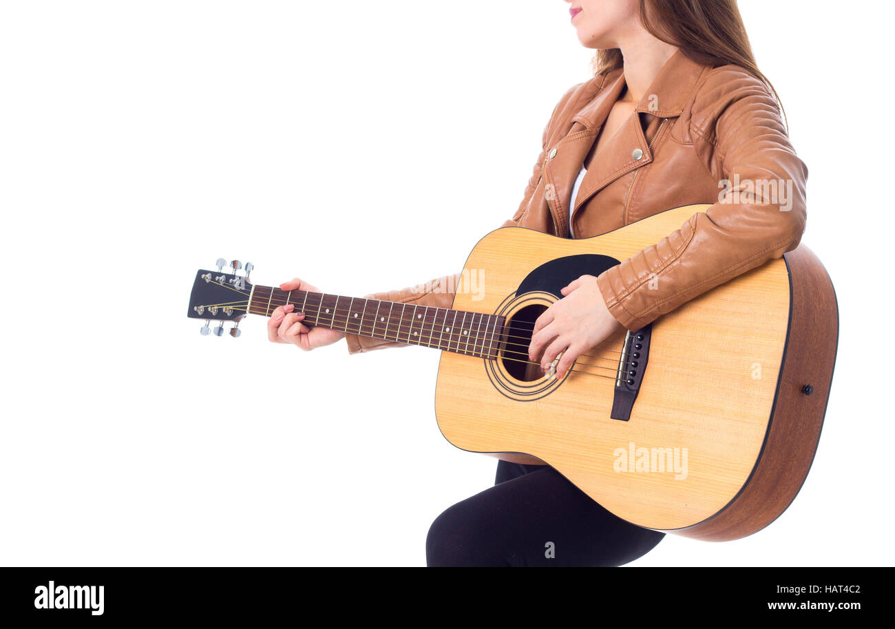 Junge Frau mit einer Gitarre Stockfoto
