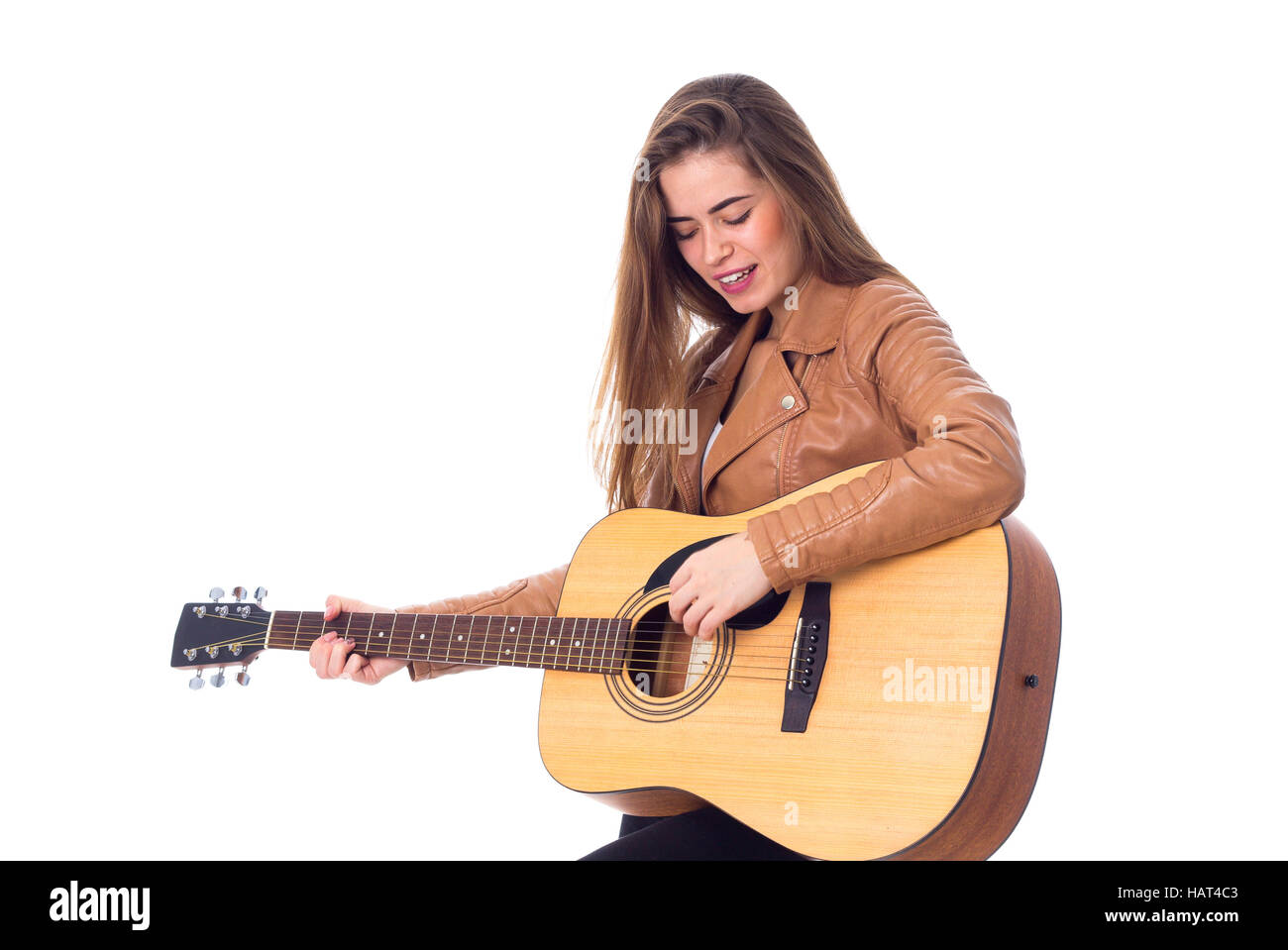 Junge Frau mit einer Gitarre Stockfoto