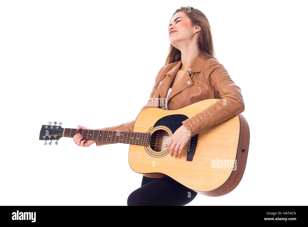 Junge Frau mit einer Gitarre Stockfoto