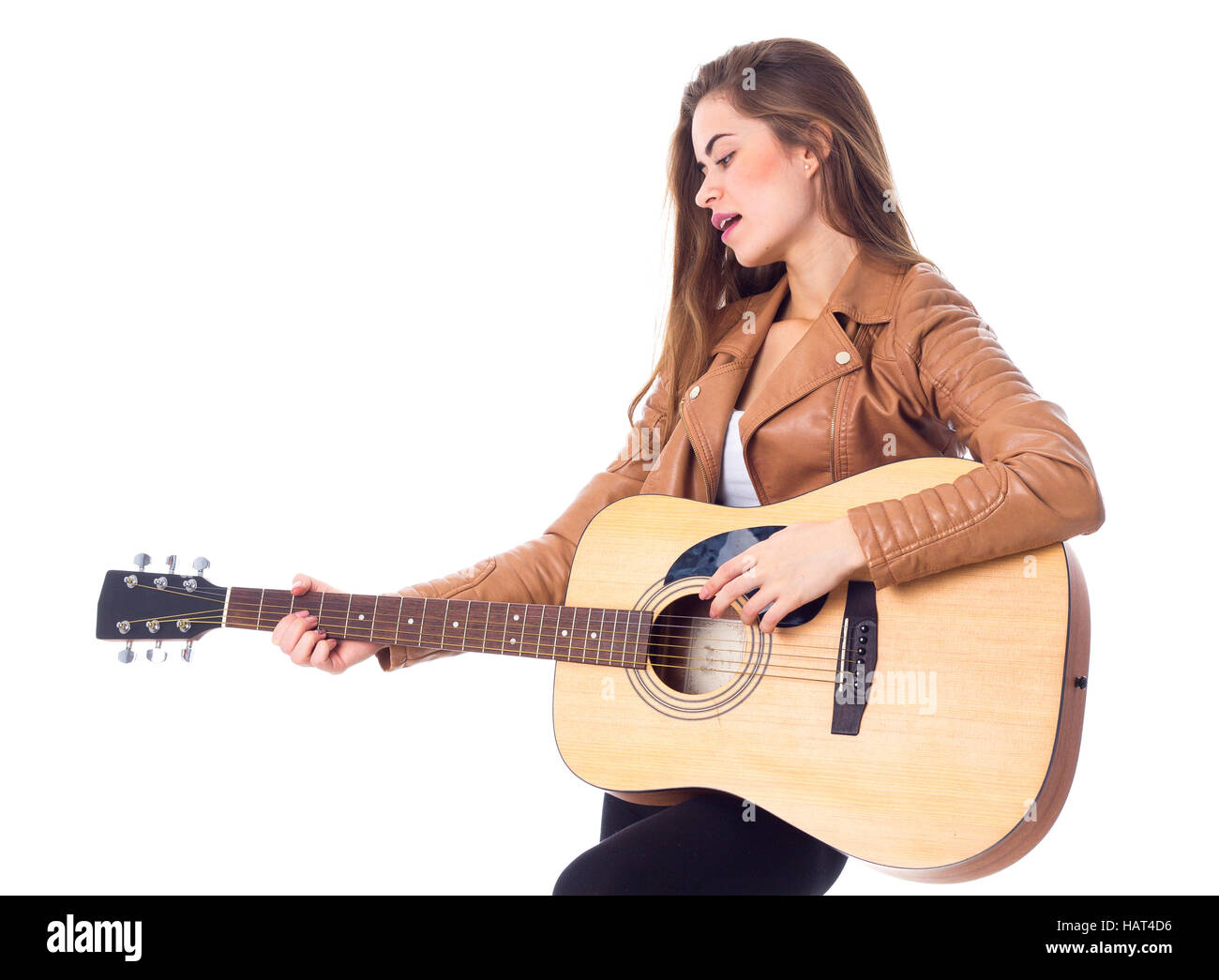 Junge Frau mit einer Gitarre Stockfoto