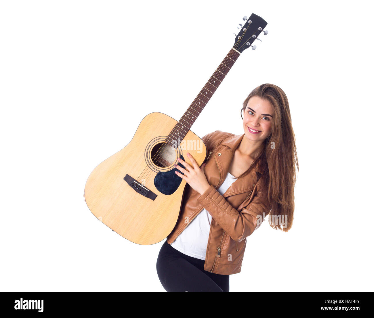 Junge Frau mit einer Gitarre Stockfoto