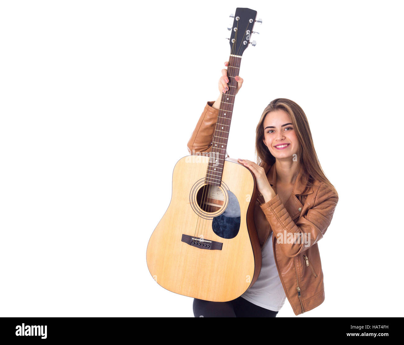 Junge Frau mit einer Gitarre Stockfoto