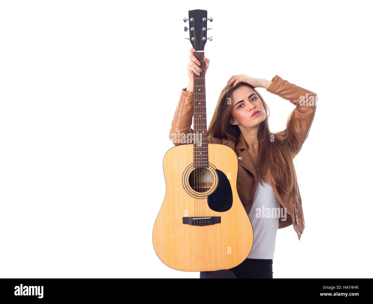 Junge Frau mit einer Gitarre Stockfoto