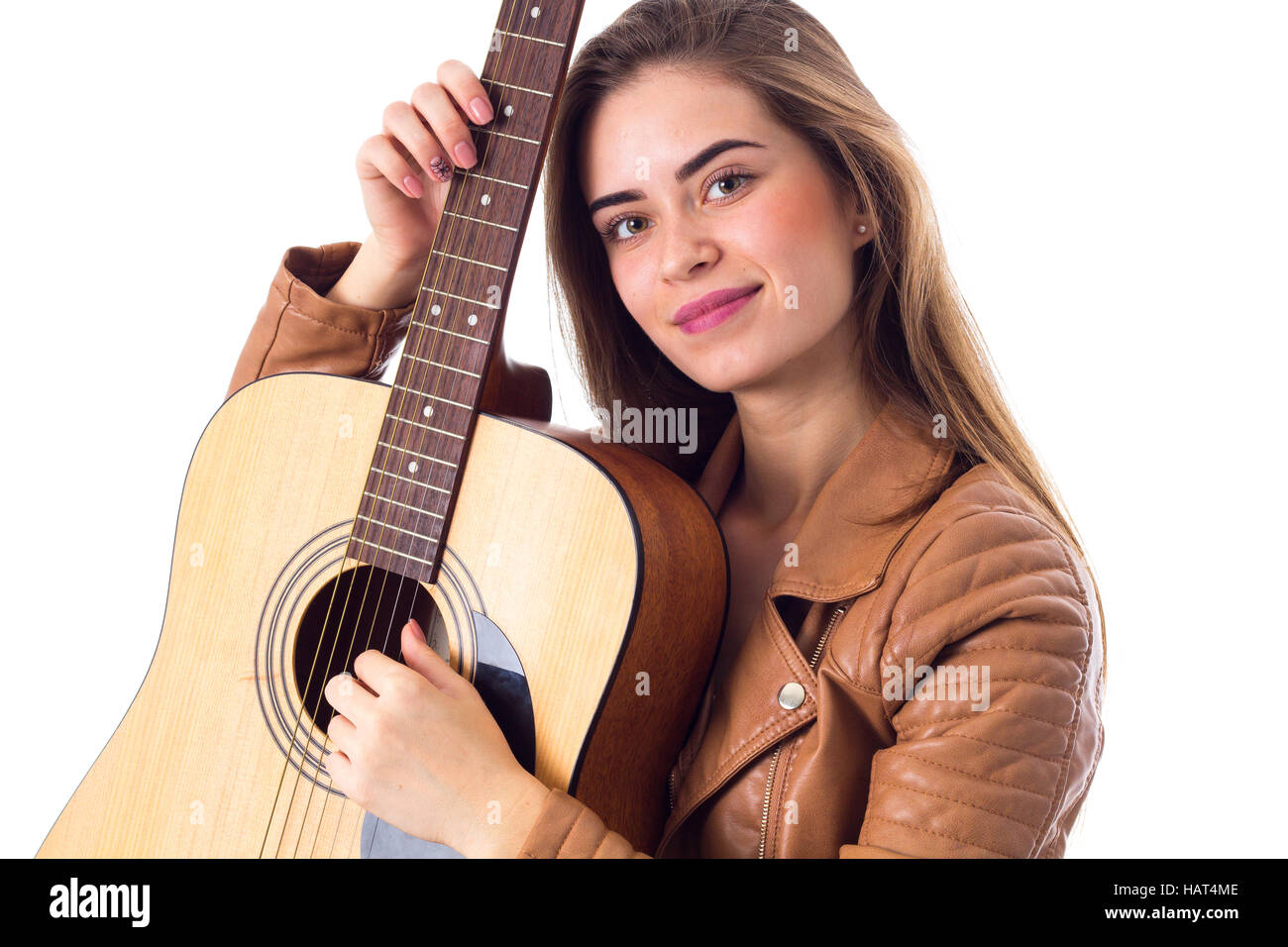 Junge Frau mit einer Gitarre Stockfoto