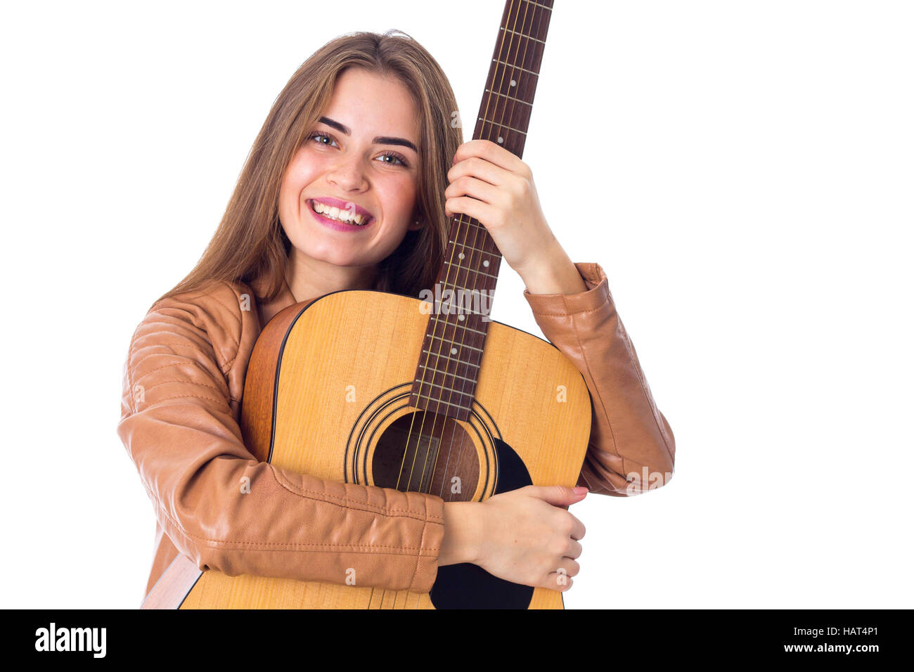Junge Frau mit einer Gitarre Stockfoto