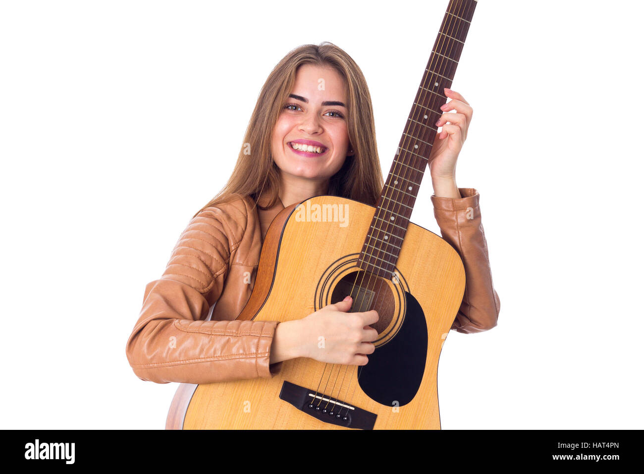 Junge Frau mit einer Gitarre Stockfoto
