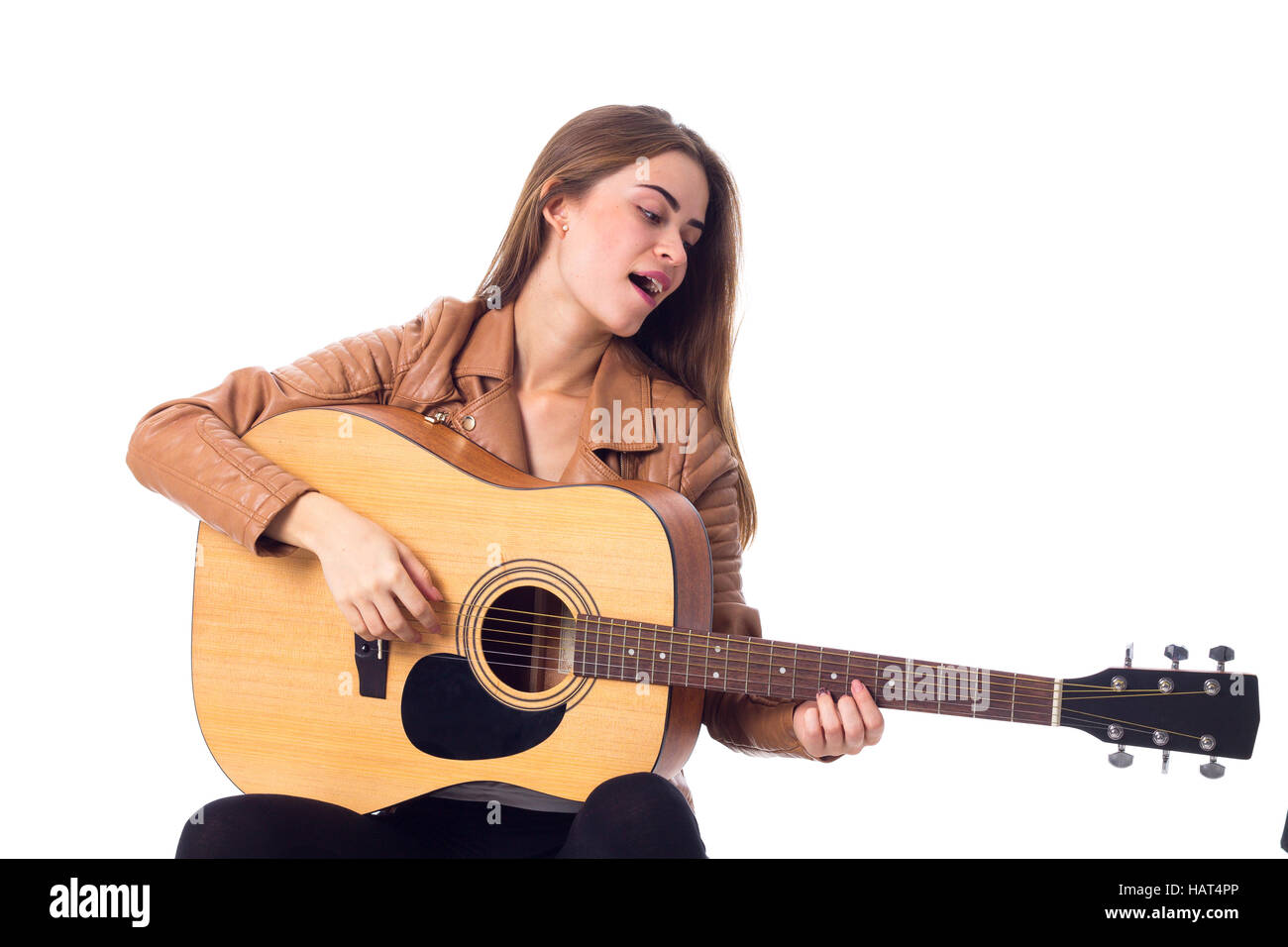Junge Frau mit einer Gitarre Stockfoto