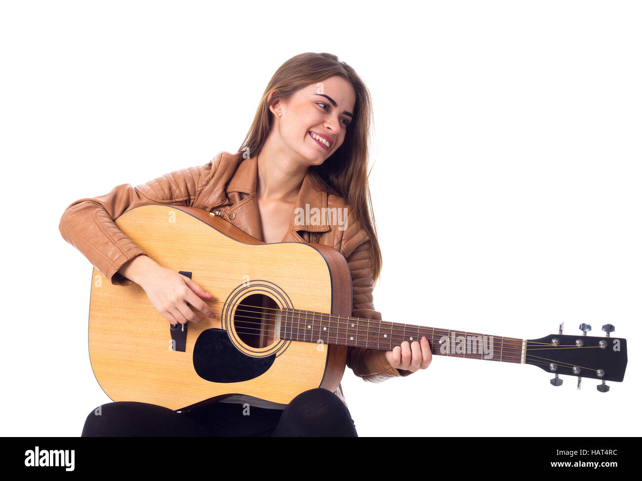 Junge Frau mit einer Gitarre Stockfoto