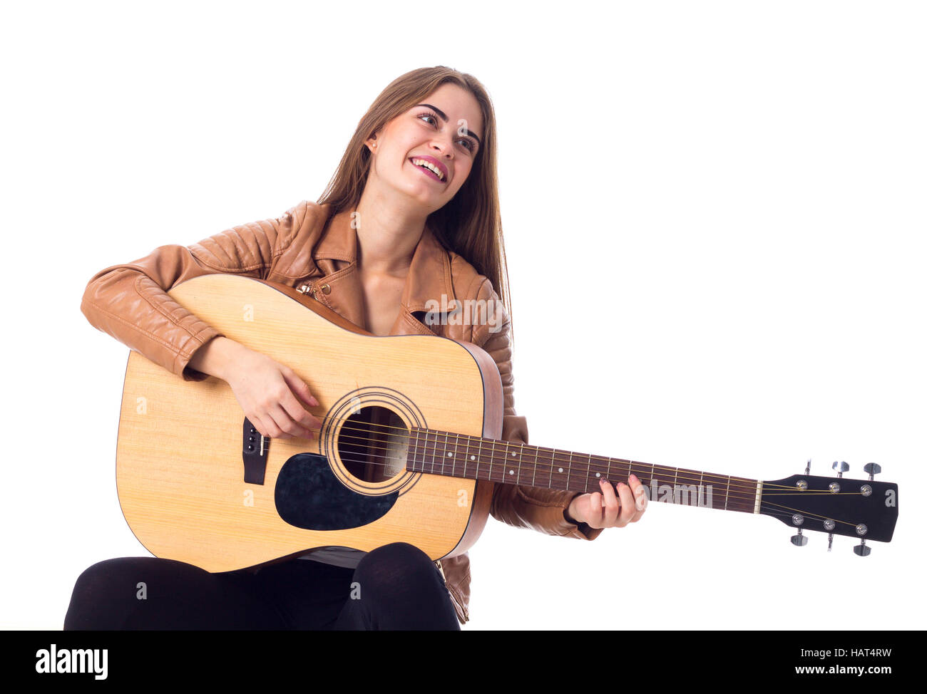 Junge Frau mit einer Gitarre Stockfoto