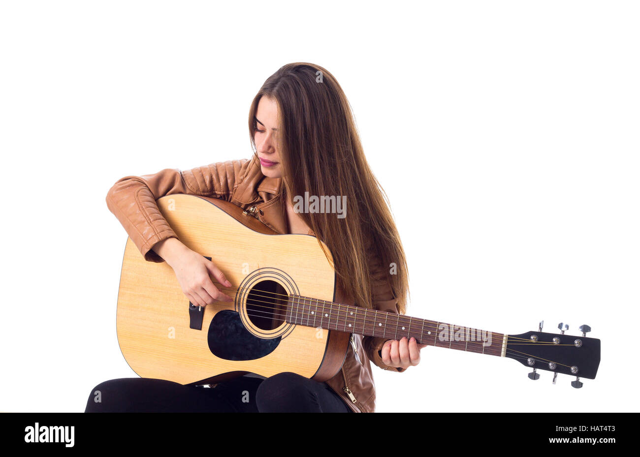 Junge Frau mit einer Gitarre Stockfoto