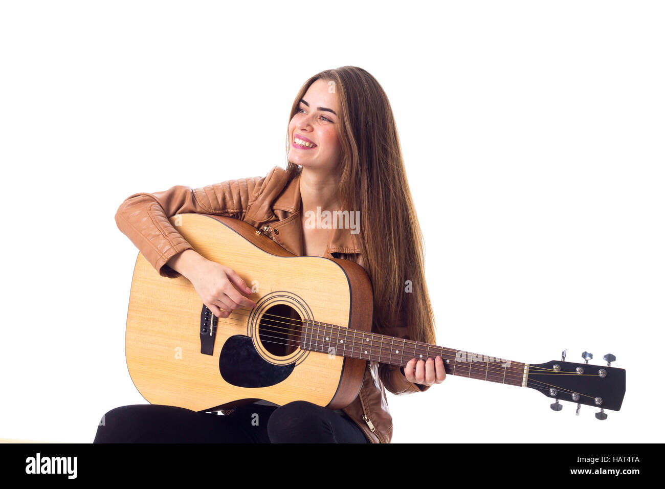 Junge Frau mit einer Gitarre Stockfoto