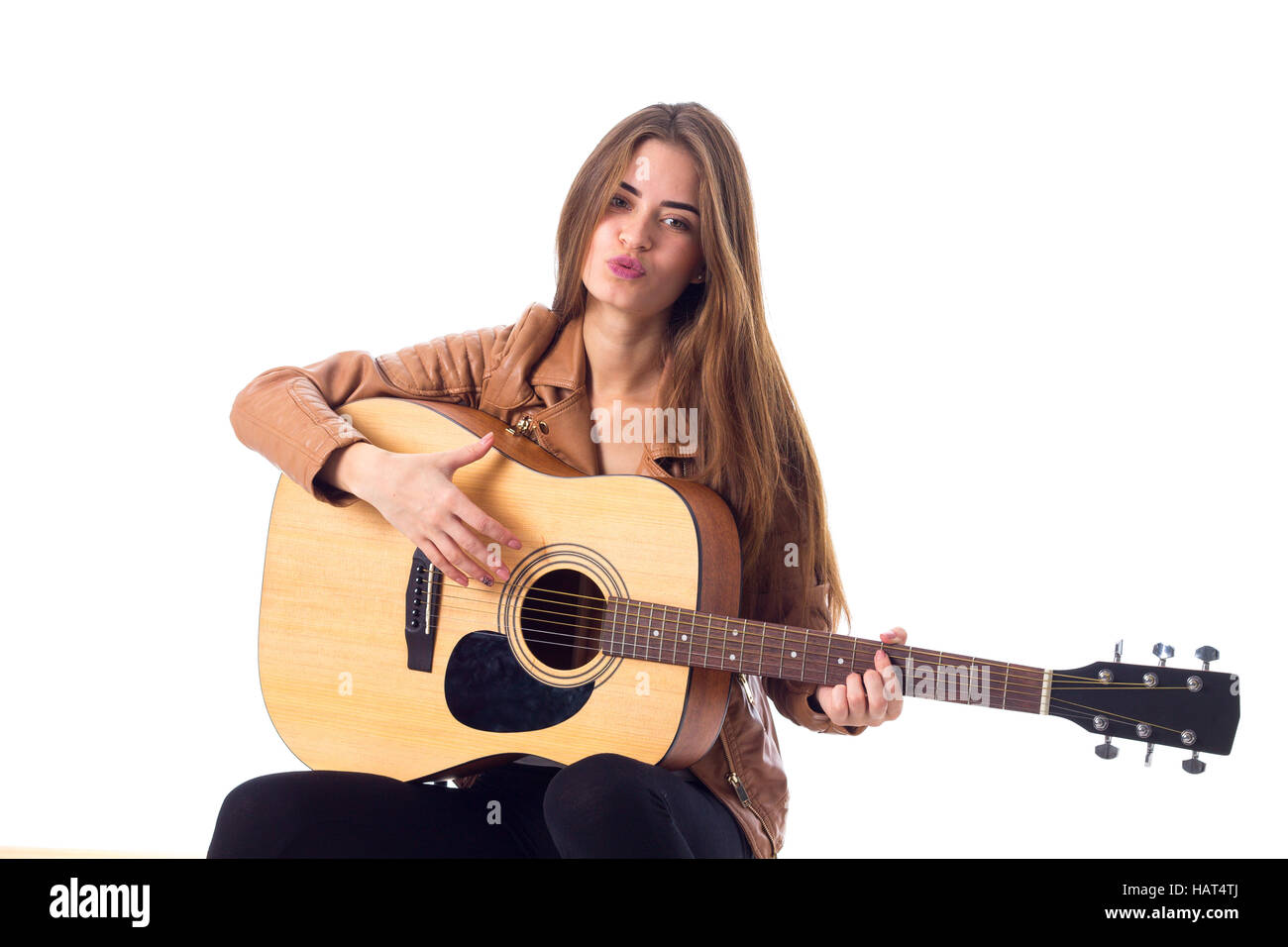 Junge Frau mit einer Gitarre Stockfoto