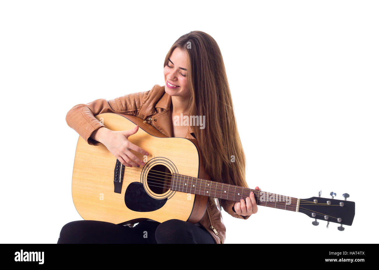 Junge Frau mit einer Gitarre Stockfoto