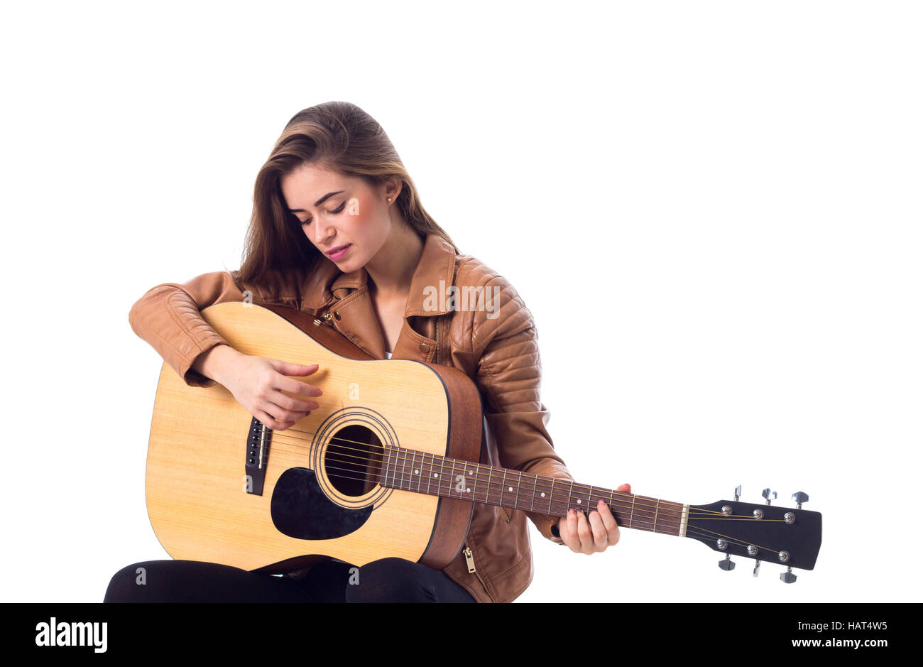 Junge Frau mit einer Gitarre Stockfoto