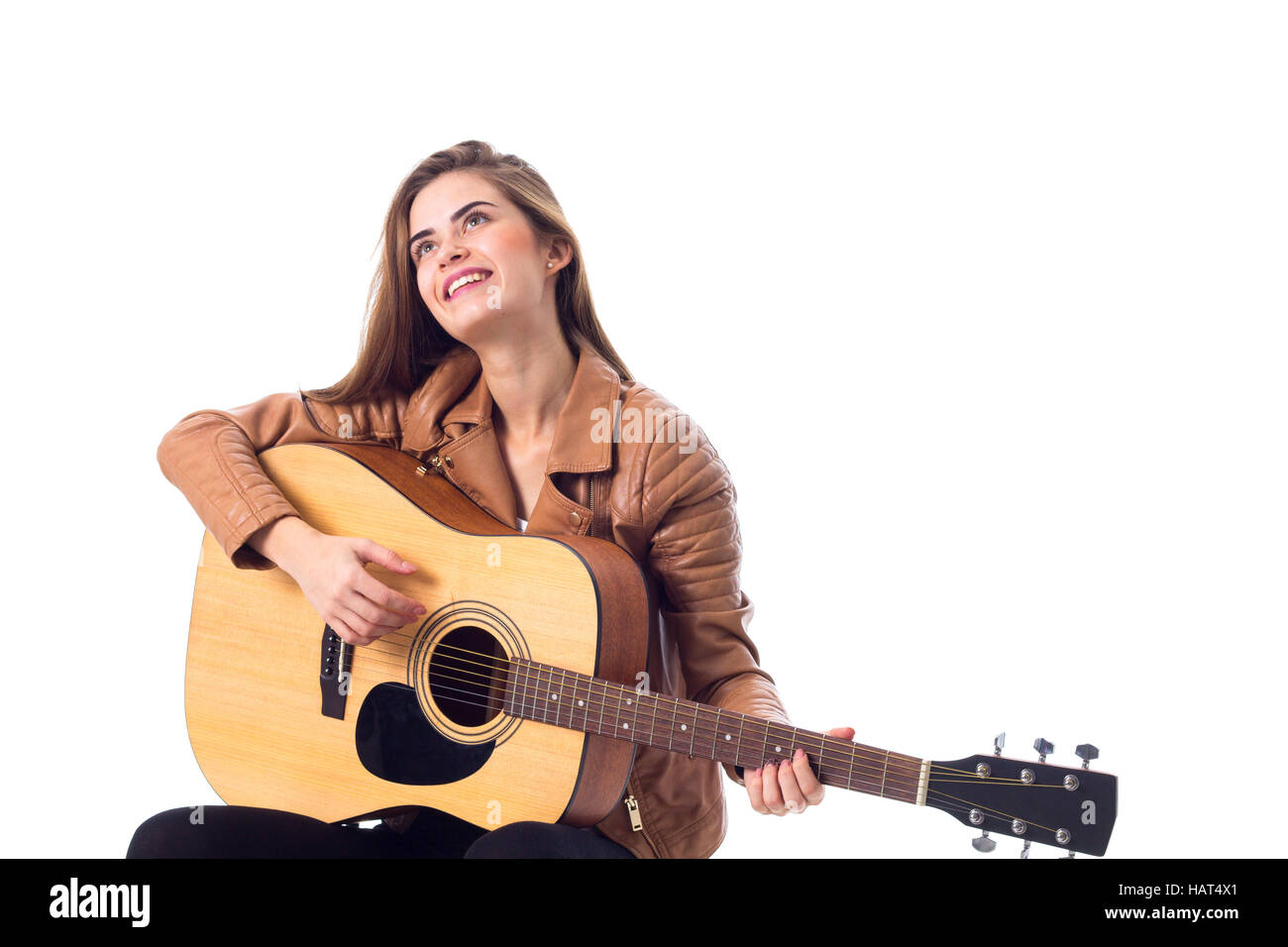 Junge Frau mit einer Gitarre Stockfoto