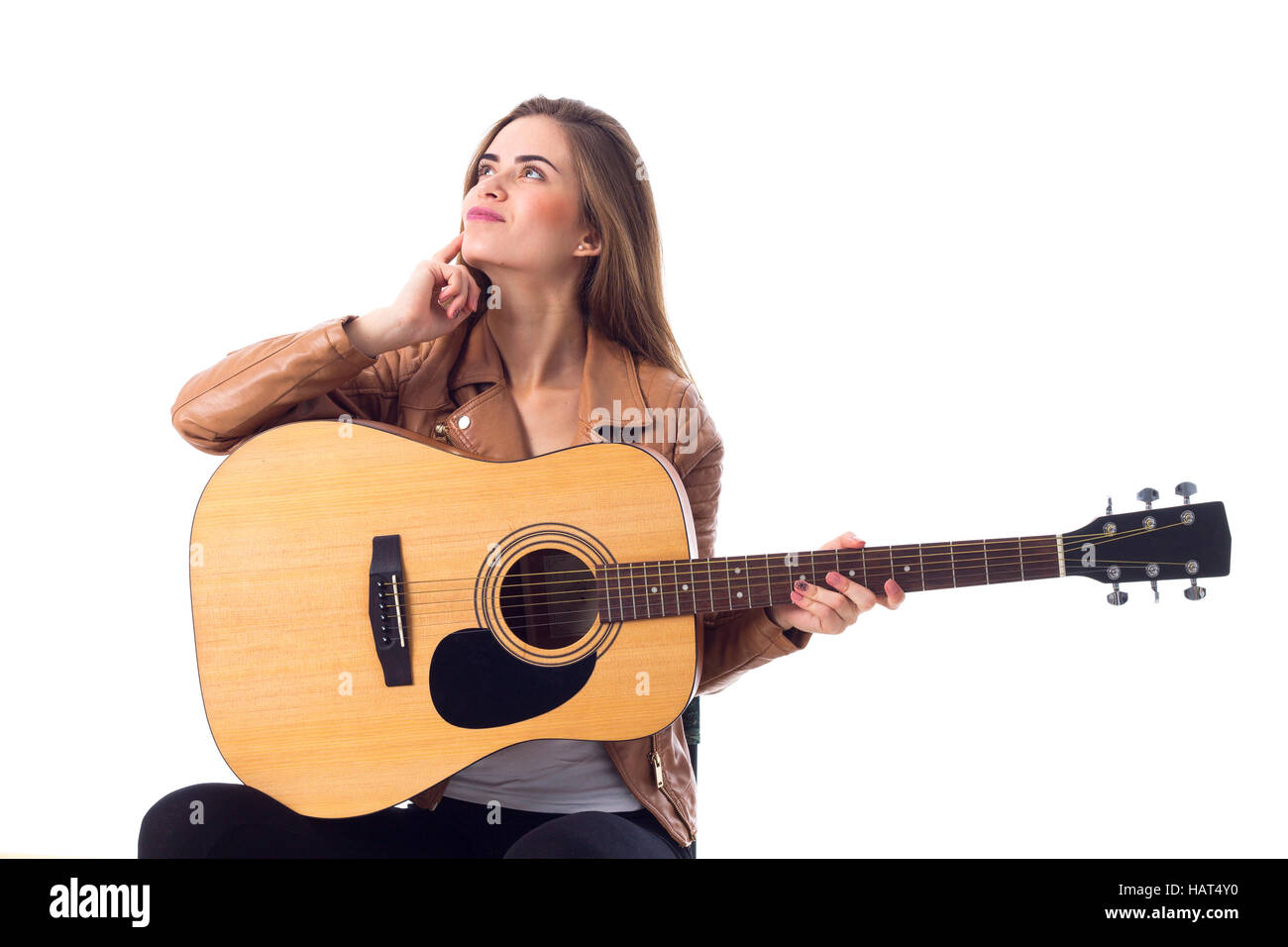 Junge Frau mit einer Gitarre Stockfoto