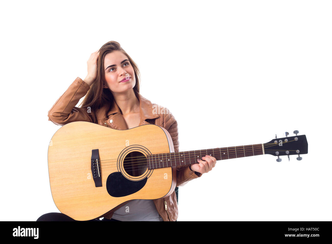 Junge Frau mit einer Gitarre Stockfoto