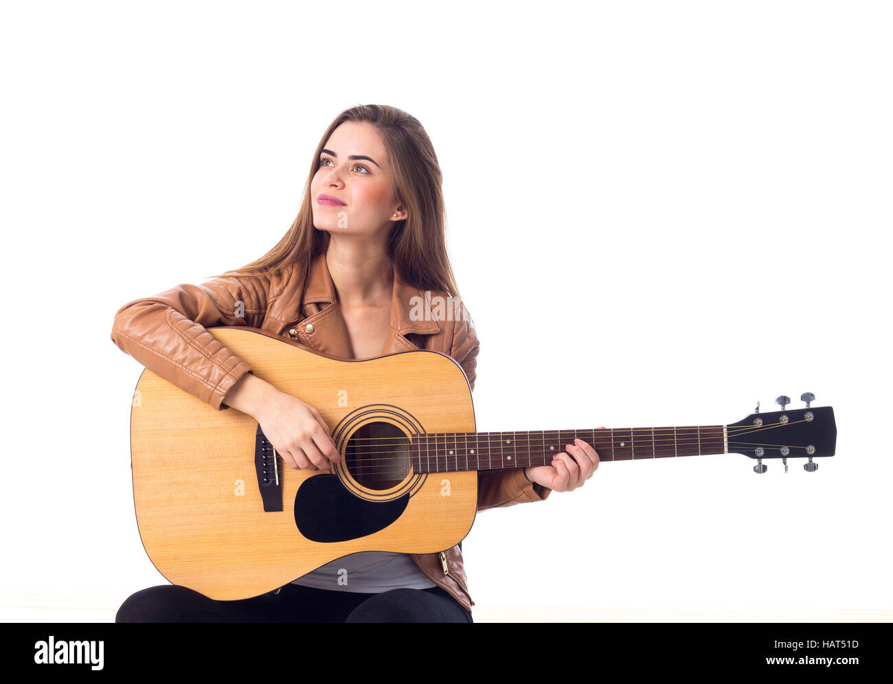 Junge Frau mit einer Gitarre Stockfoto